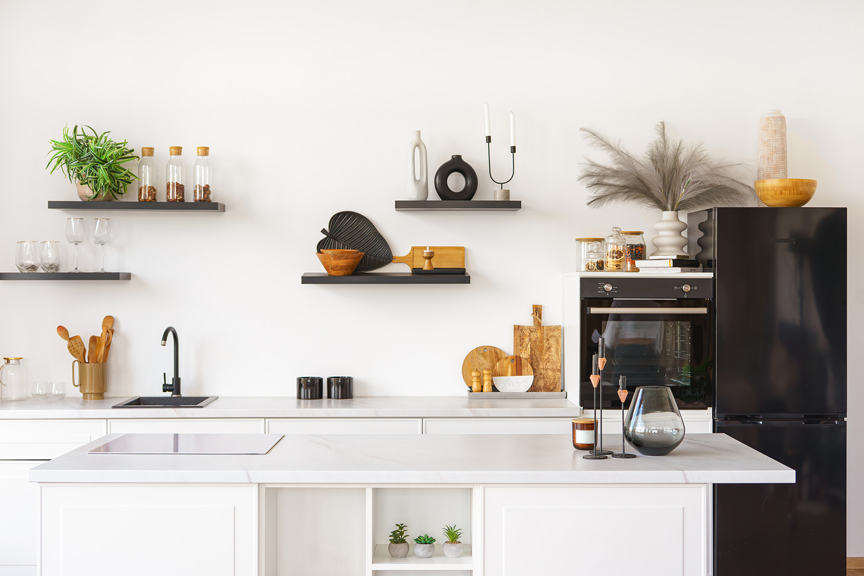 Kitchen interior with countertop and black water tap on white wa zupa